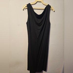 Black sleeveless evening dress with a scoop neck, by Spanner
